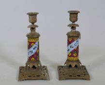 A pair of C19th brass candlesticks with enameled decoration, 23cm high