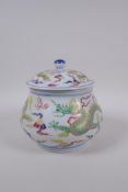 A Chinese polychrome porcelain ginger jar and cover with enamelled green dragon decoration, Xuande 6