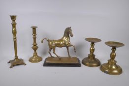 A well cast brass figure of a horse with the remains of silver plate, a pair of brass