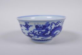 A blue and white porcelain tea bowl with dragon decoration, Chinese Xuande 6 character mark to base,