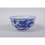 A blue and white porcelain tea bowl with dragon decoration, Chinese Xuande 6 character mark to base,