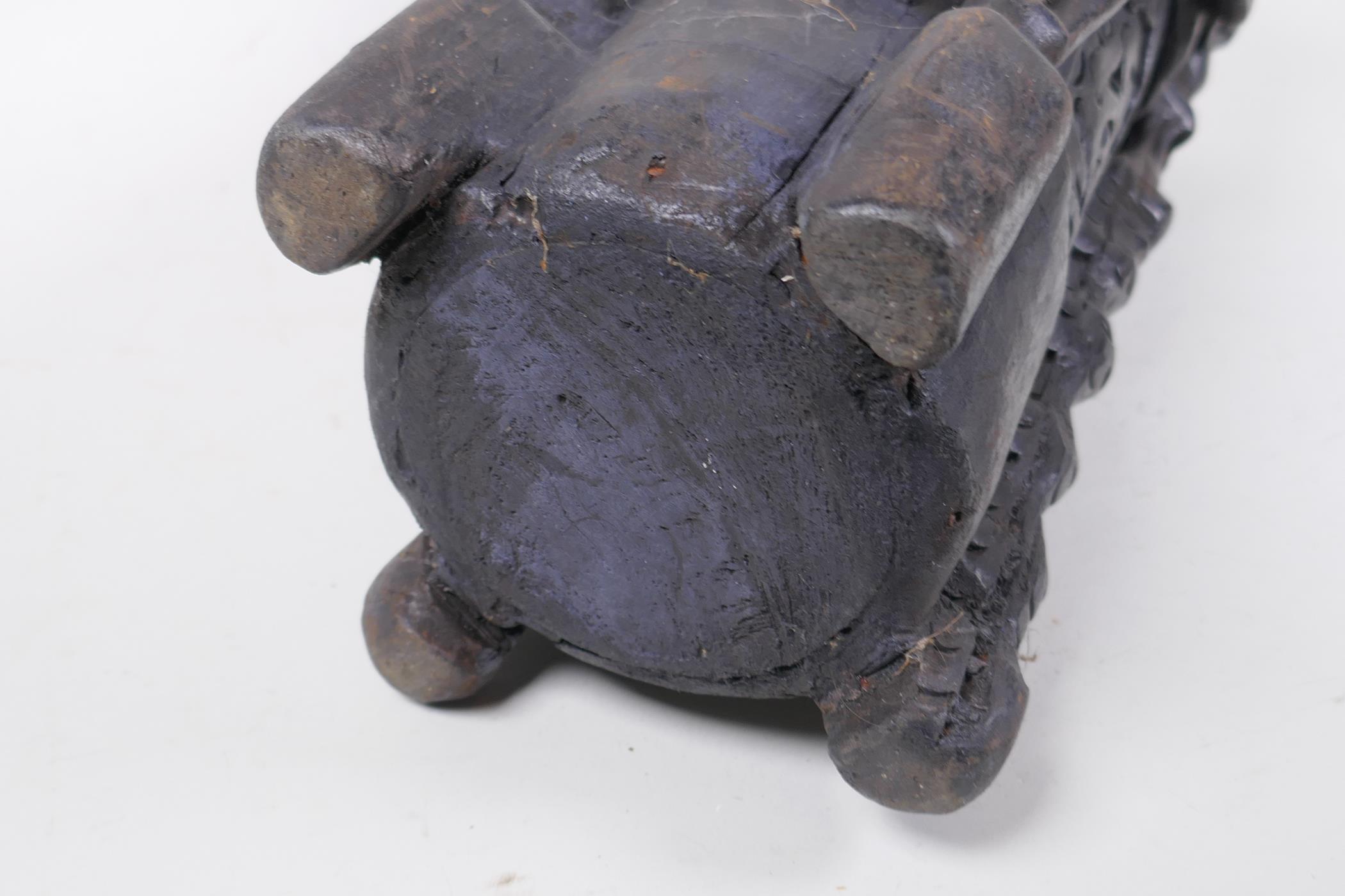 An Indonesian Dayak tribal carved and ebonised wood stick stand with figural and animal - Image 6 of 6