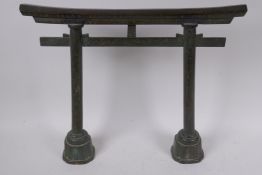 A Japanese bronze gong stand in the form of a Torri gate, 36cm high, 42cm wide