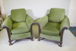 A pair of country house deep seated Chippendale style armchairs with card decoration, raised on