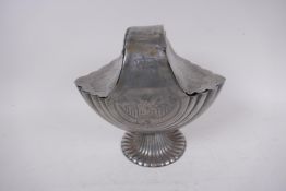 An early C19th silver plated Britannia metal nautilus spoon warmer, 21cm high