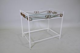 A painted wrought metal glass topped two tier table with a pierced gallery, lacks glass for