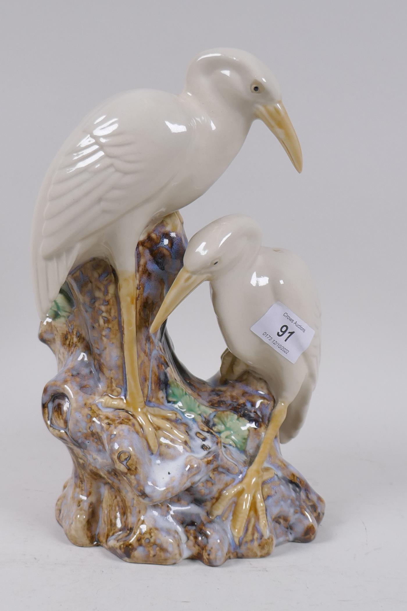 A majolica spill vase in the form of two cranes, 26cm high