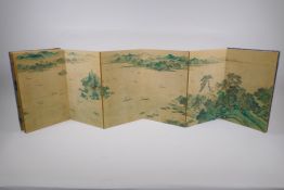 A Chinese printed concertina book decorated with an extensive riverside landscape, 18 x 28cm