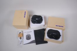 Two boxed and unused TKMars GPS trackers, complete with accessories and manuals, untested