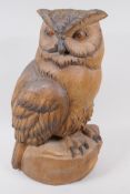 A Black Forest carved wood figure of an owl, with painted eyes, 44cm high