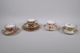 A Royal Crown Derby Imari pattern trio and matching tea plate, and three Royal Crown Derby duos,