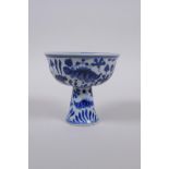 A blue and white porcelain stem cup decorated with carp in a lotus pond, Chinese Xuande 6