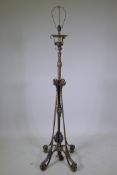 A C19th adjustable brass lamp stand of organic leaf form in the manner of Benson, converted to