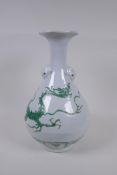 A Chinese porcelain vase with a frilled rim, twin kylin mask handles and green dragon decoration,