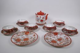 A Japanese Kutani porcelain tea set with figural decoration, and a pair of Kutani cabinet plates,