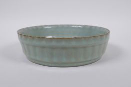 A Chinese Ru ware style celadon glazed steep sided dish with frilled rim, 18cm diameter