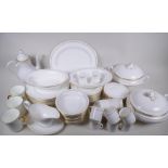 A Royal Worcester white and gilt Contessa pattern porcelain dinner service, ten place setting of 27,