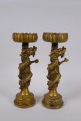 A pair Chinese filled bronze pricket candlesticks decorated with dragons, 4 character mark to