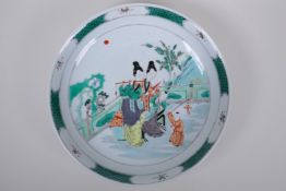 A famille verte porcelain charger decorated with women and children, Chinese Kangxi 6 character mark