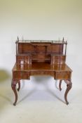 A C19th mahogany desk, the upper section with gallery and four drawers raised on barleytwist