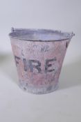 A vintage painted galvanised metal fire bucket, 28cm high, 31cm diameter