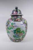 A Chinese famille noire jar with millefiori decoration and painted landscape panels, seal mark to