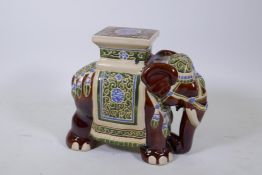 A Chinese Sancai glazed porcelain elephant stool, 43cm high, 50cm long