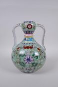 A polychrome porcelain garlic head shaped vase with two handles and floral decoration, Chinese