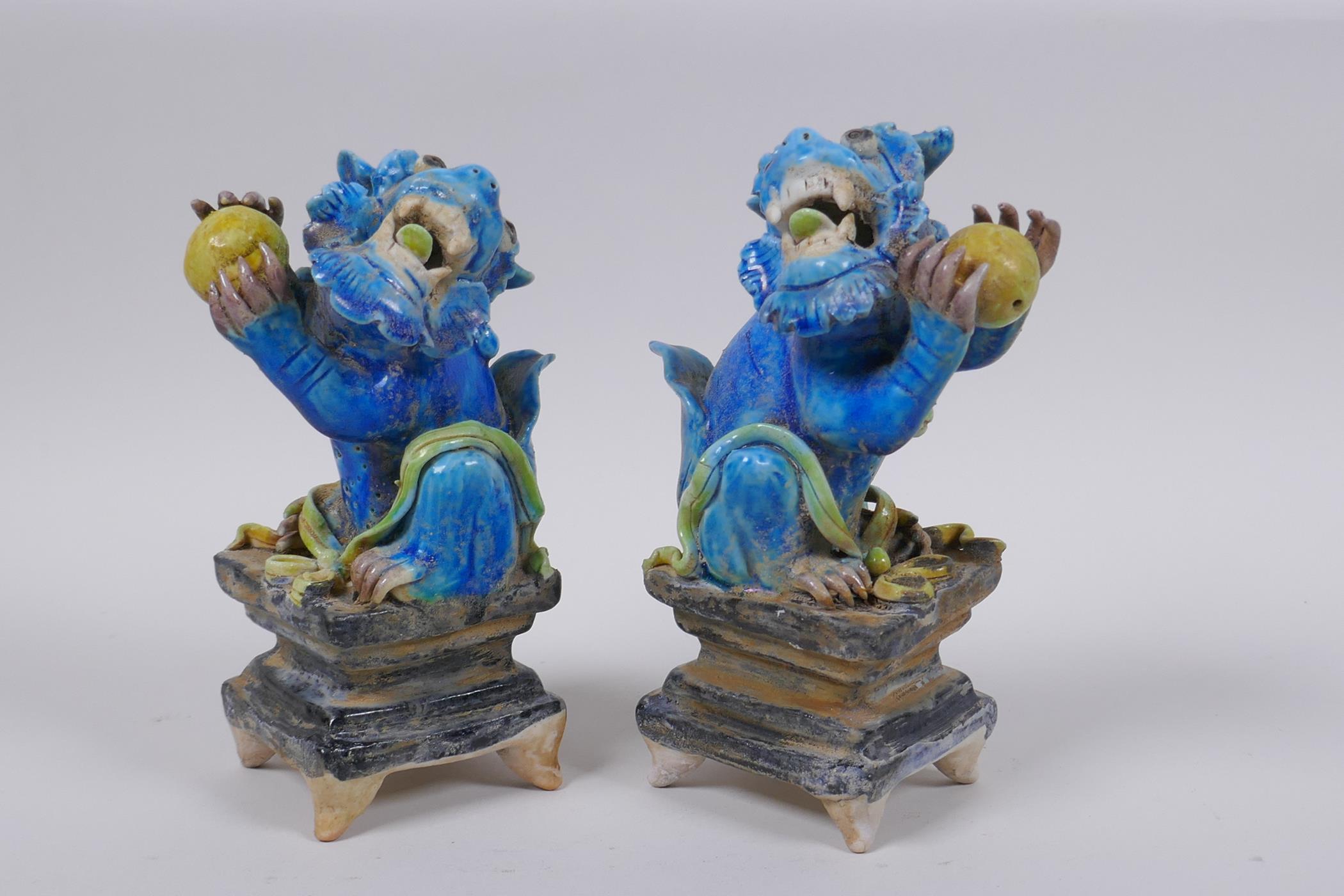 A pair of Chinese turquoise glazed porcelain figure of kylin, 14cm high