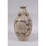 A Chinese Cizhou kiln vase with four loop handles and chased floral decoration, 23cm high