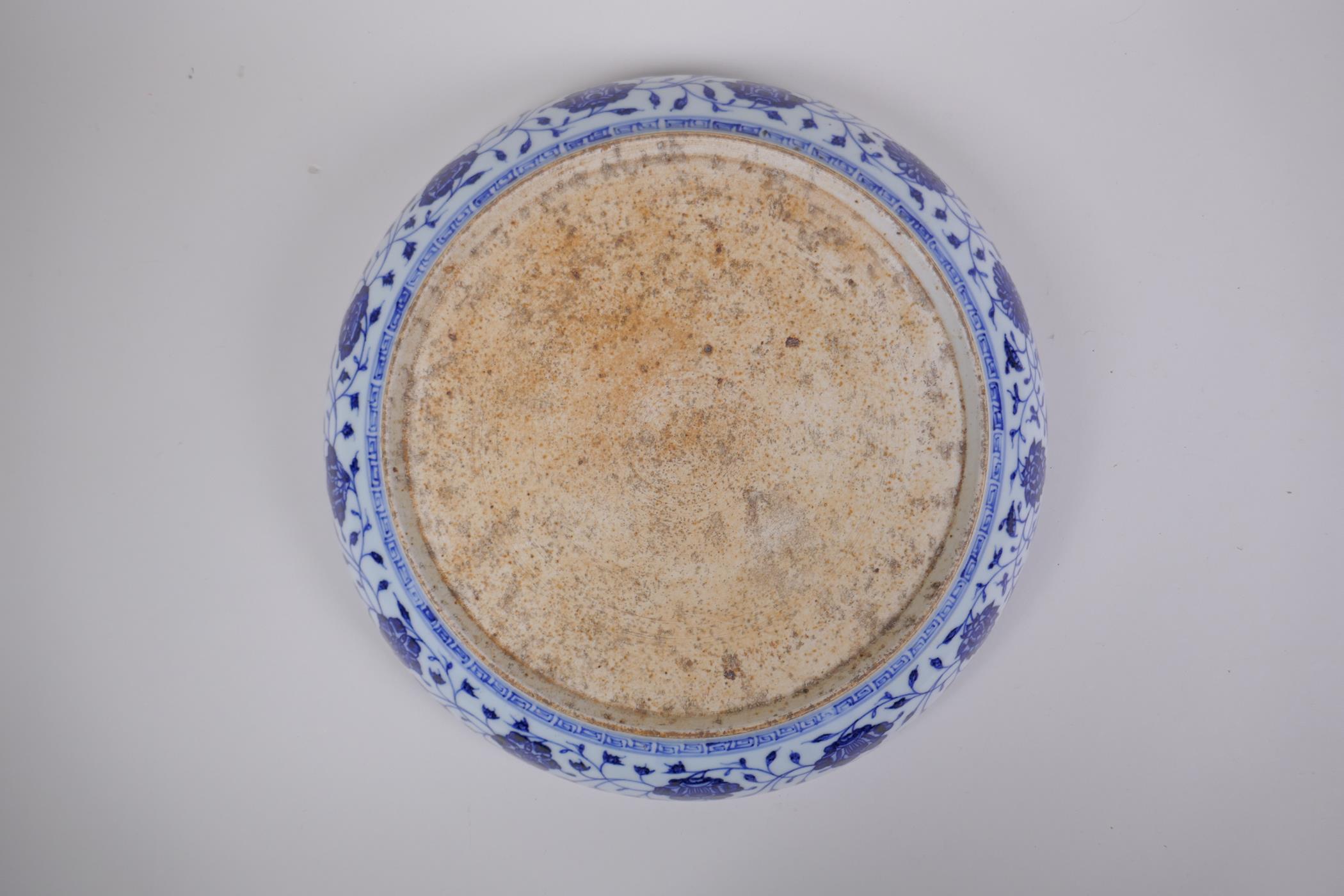 A blue and white porcelain charger with lotus flower decoration, Chinese Xuande 6 character mark - Image 4 of 5