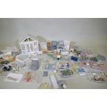 A large collection of dolls house furnishings, clothing, porcelain bathroom set, accessories etc