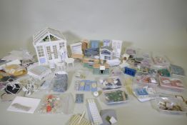 A large collection of dolls house furnishings, clothing, porcelain bathroom set, accessories etc