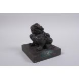 A Chinese bronze seal with a kylin knop, 9 x 9cm