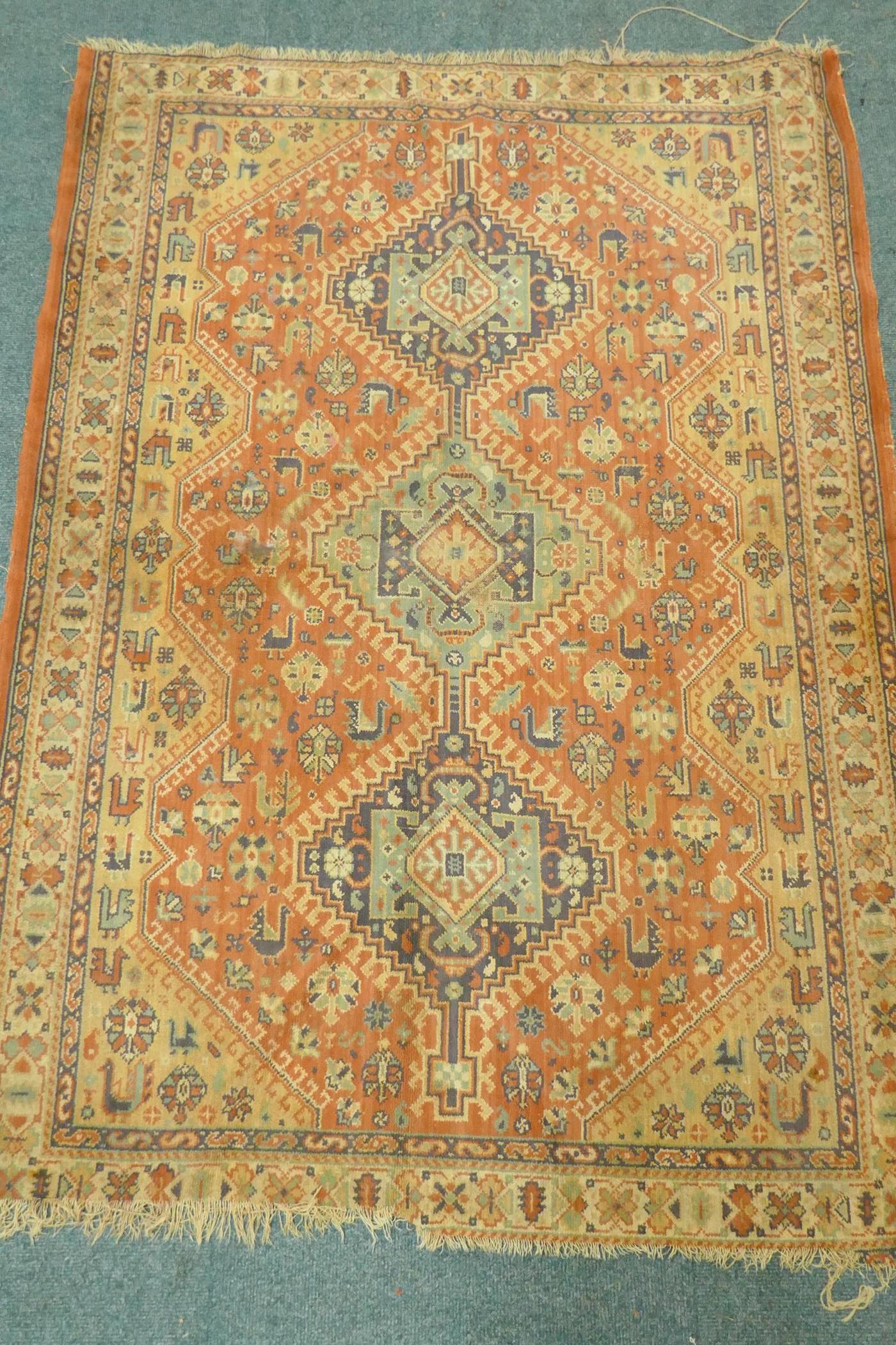 A Middle Eastern wool carpet with medallion design on a faded terracotta field, 160 x 110cm - Image 2 of 5