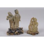 Two Chinese carved soapstone figures, depicting Shou Lao and a couple, largest 16cm high