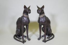 A pair of bronze cats, 61cm high
