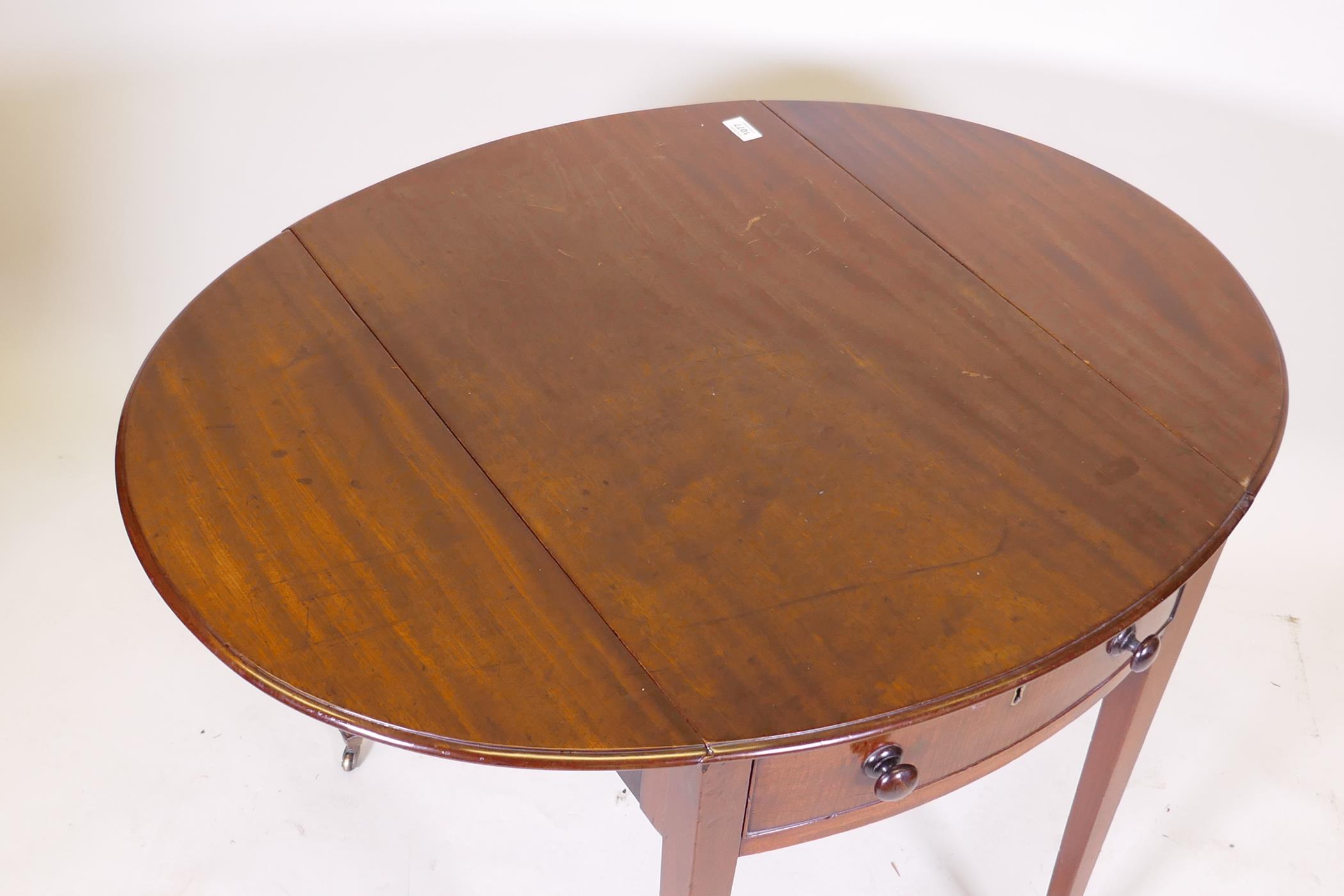A George III mahogany Pembroke table with single drawer and bow ends, raised on square tapering - Image 3 of 7