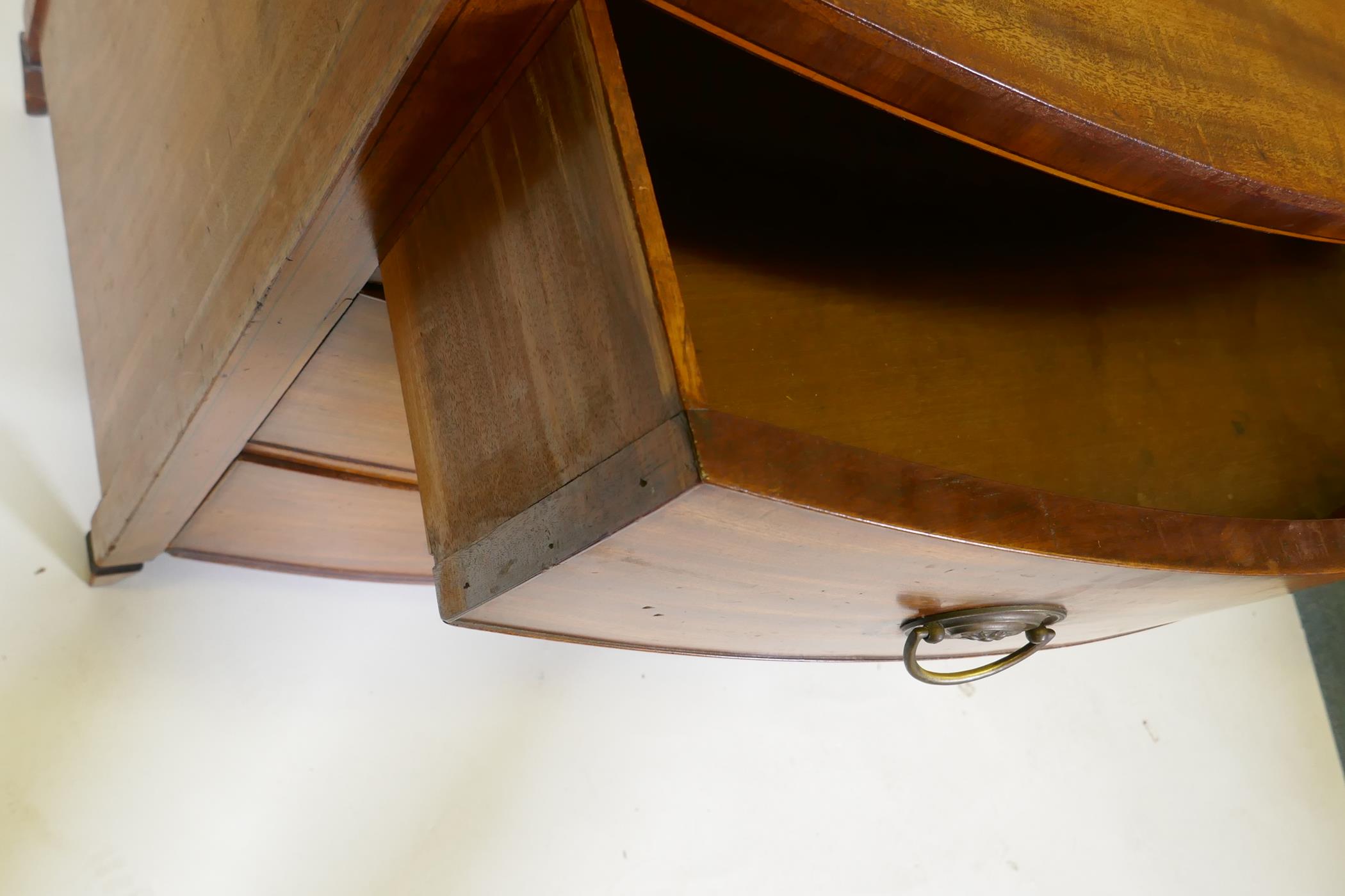 A C19th mahogany Sheraton style bow front chest of three long drawers with brass plate handles, - Image 9 of 9