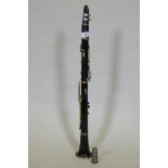 A vintage ebony clarinet, stamped B Flat, First Quality, Paris, B.K. Mundul & Co, Calcutta, 65cm