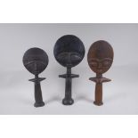 Three antique African carved hardwood Akuaba fertility dolls, largest 36cm