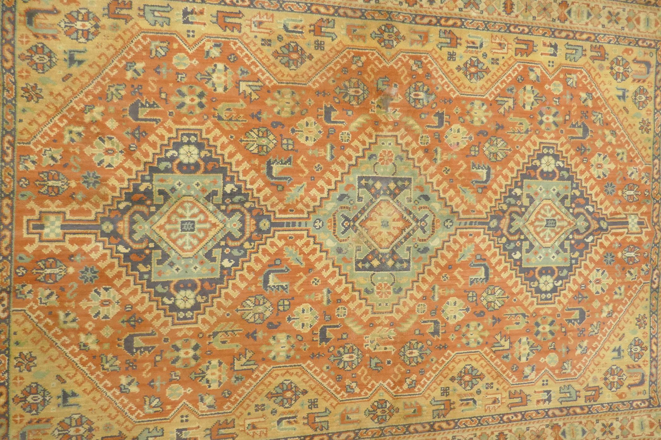 A Middle Eastern wool carpet with medallion design on a faded terracotta field, 160 x 110cm - Image 4 of 5