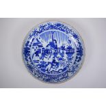 A Chinese Republic blue and white porcelain charger decorated with figures on horseback, 29cm