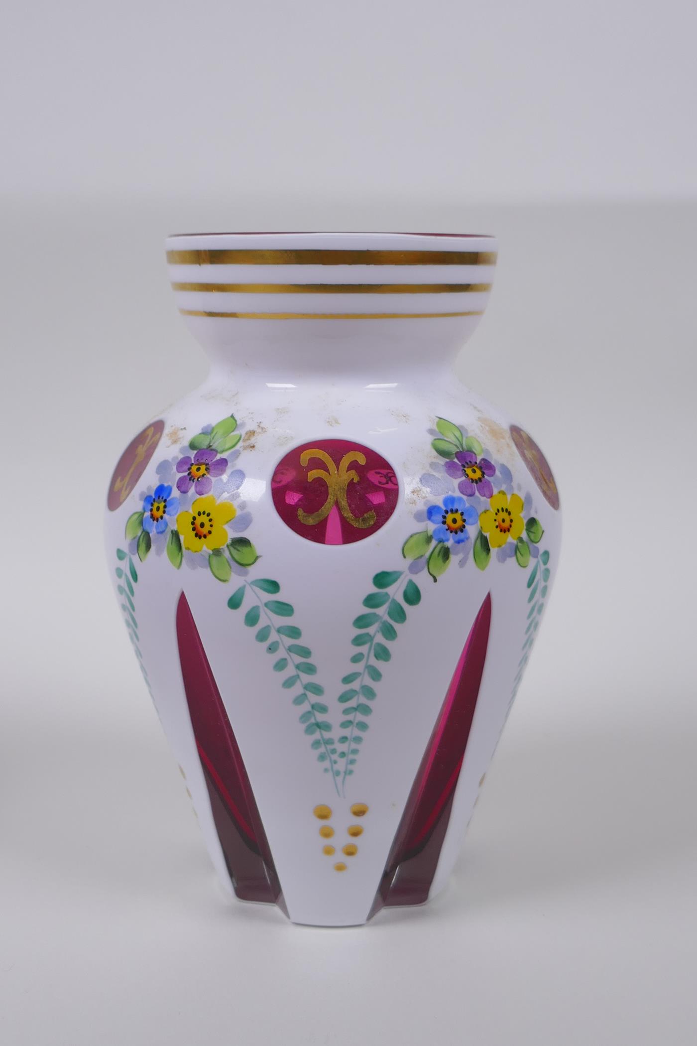 A Bohemian style overlaid ruby glass vase with hand painted floral decoration, and a similar pot and - Image 2 of 8