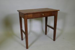 An Arts and Crafts oak single drawer side table, raised on square tapering supports united by end