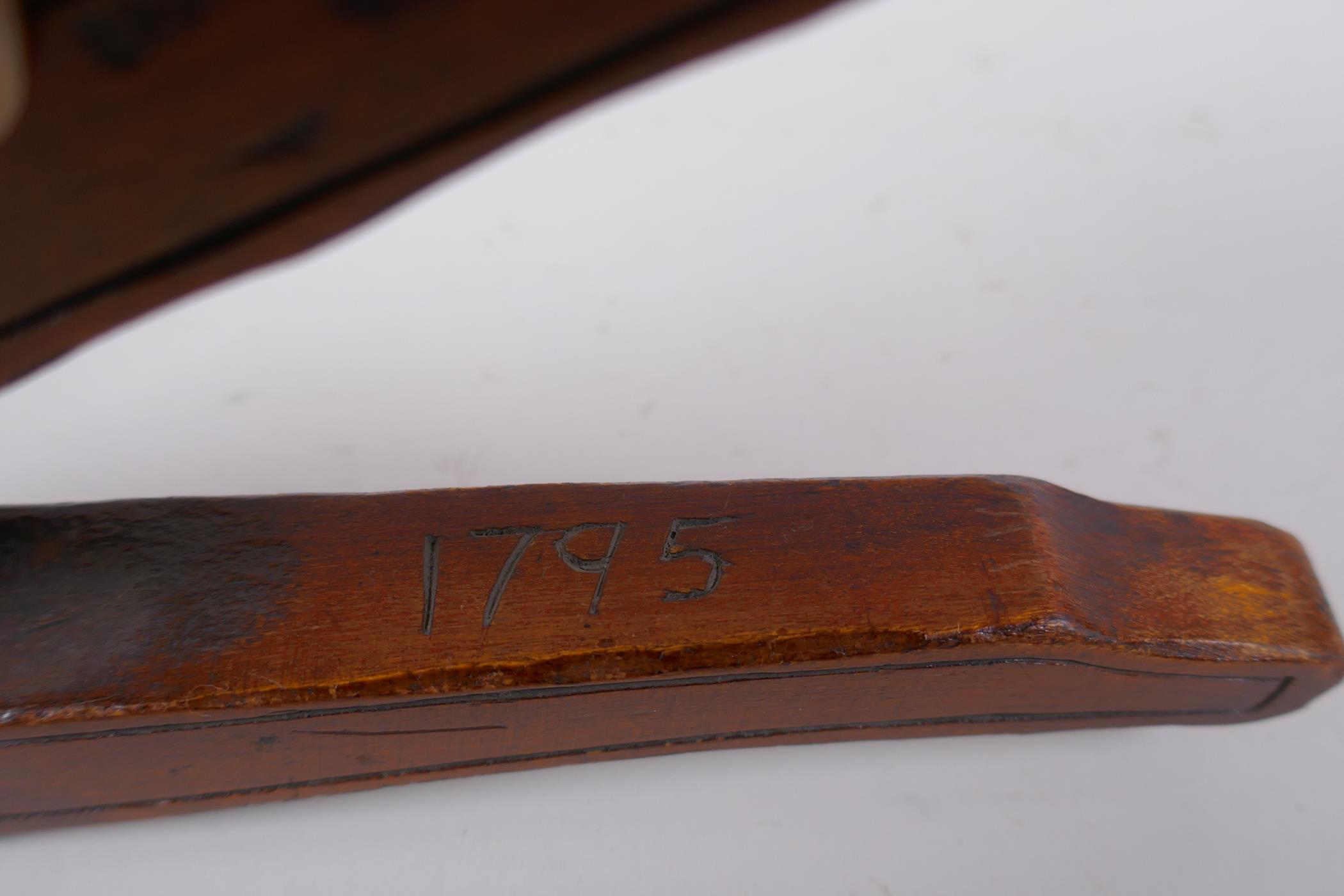 An antique walnut nut cracker with copper plates, inscribed, 19cm long - Image 4 of 5