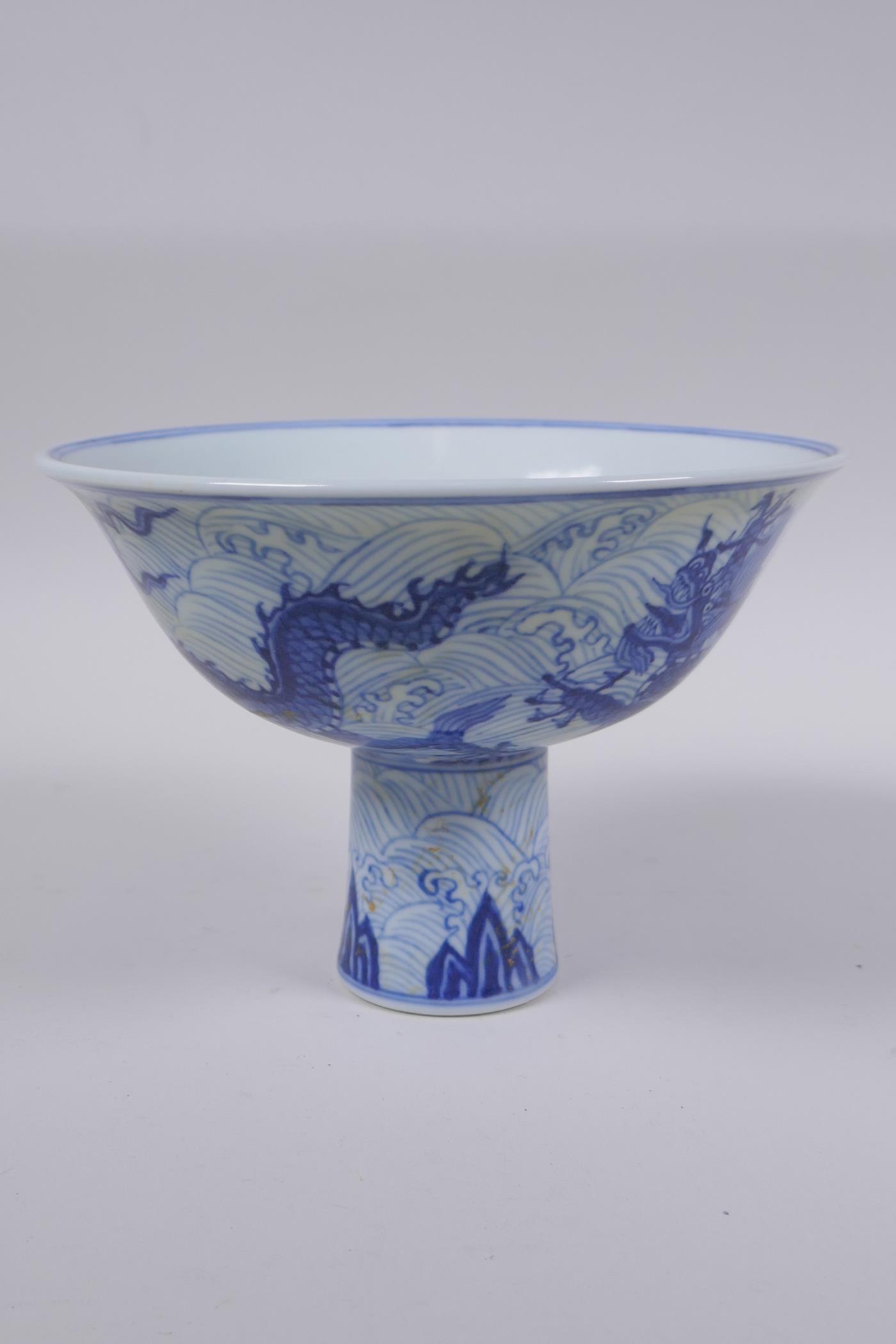 A blue and white porcelain stem bowl with dragon decoration, Chinese Xuande 6 character mark to - Image 2 of 6