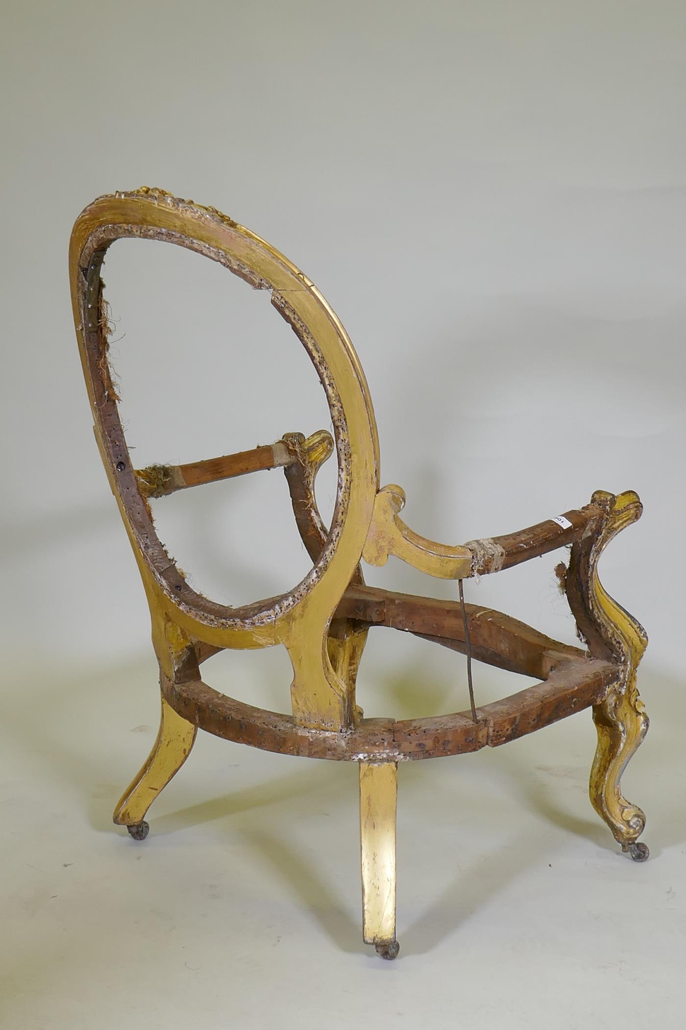 A C19th giltwood spoon back open arm chair with carved crest and scrolled, raised on cabriole - Image 5 of 5