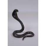 An oriental bronze figure of a cobra, 19cm high