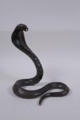 An oriental bronze figure of a cobra, 19cm high